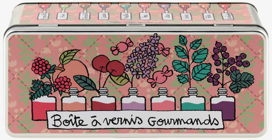 Bild av färgglad plåtburk med nagellack och växter