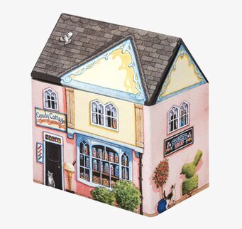 Bild av charmig plåtburk som föreställer ett hus