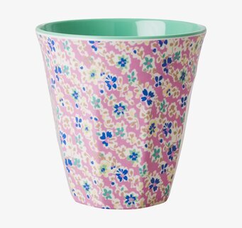 Bild av färgglad mugg med blommönster och mintgrön insida