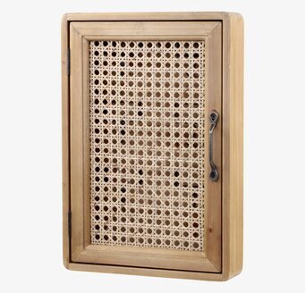 Bild av stilrent nyckelskåp med rottingdetaljer