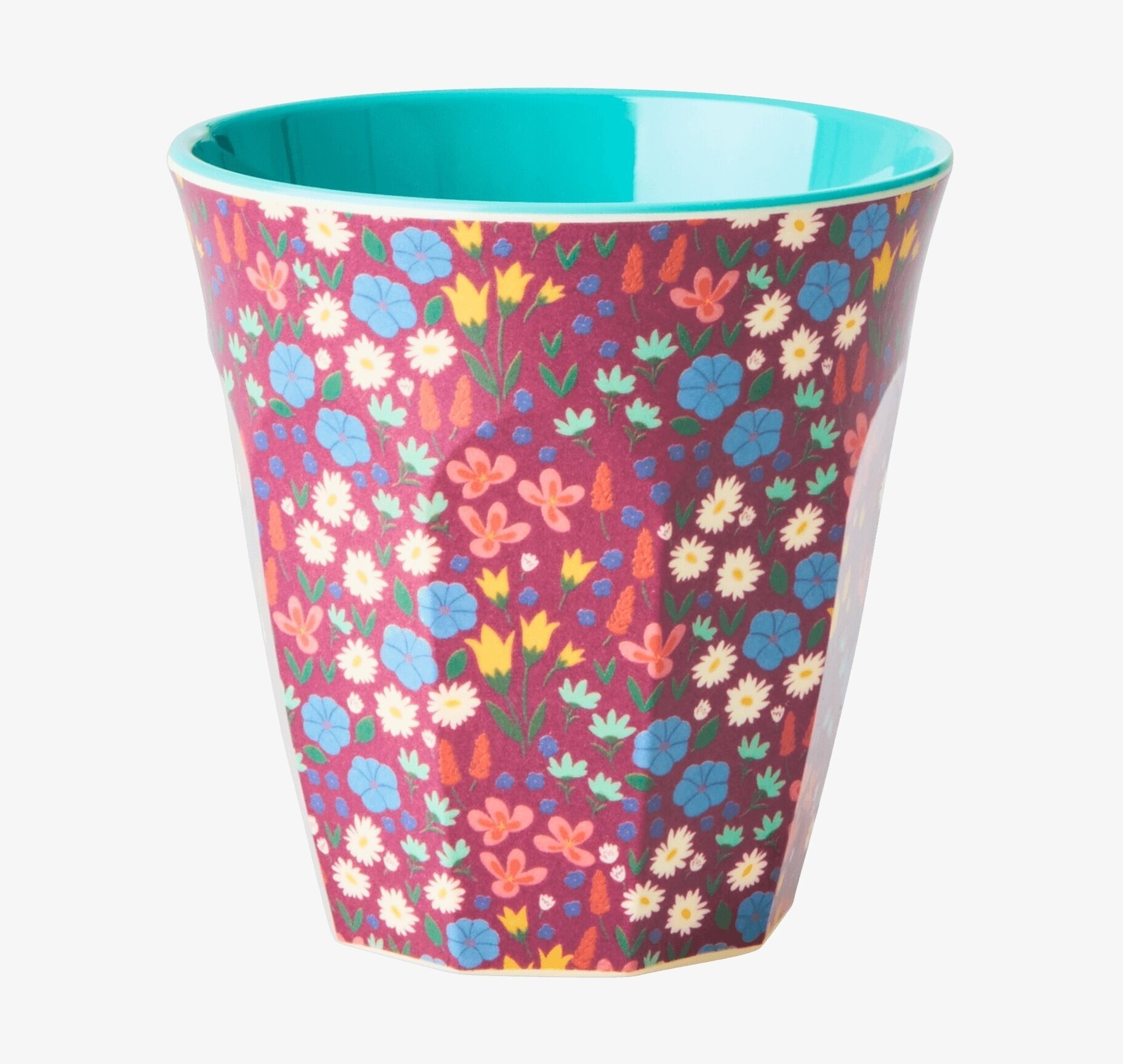 Bild av livfull mugg med blommigt mönster och färgklick