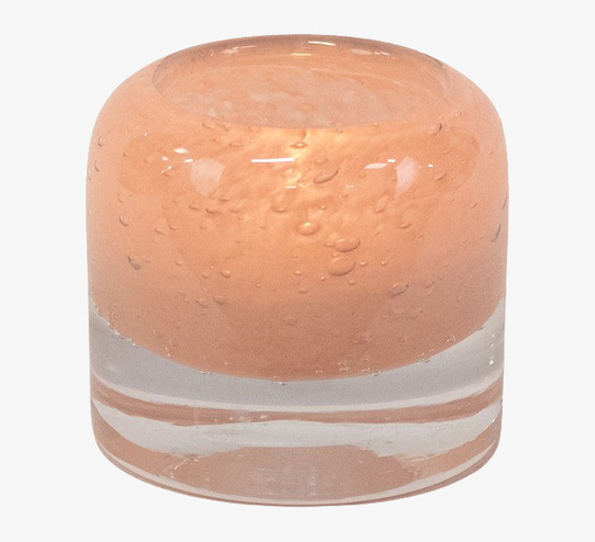 Foto av elegant rosa ljushållare i glas med bubblor