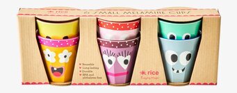 Bild av färgglada och lekfulla muggar med ansikten