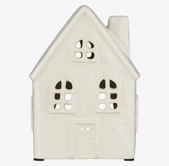 Bild av ljuslykta med husdesign och välvda fönster