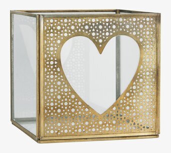 Foto av elegant ljusstake med hjärta och glasdetaljer