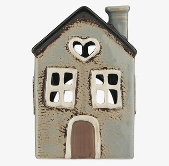 Foto av charmig ljuslykta i form av ett hus