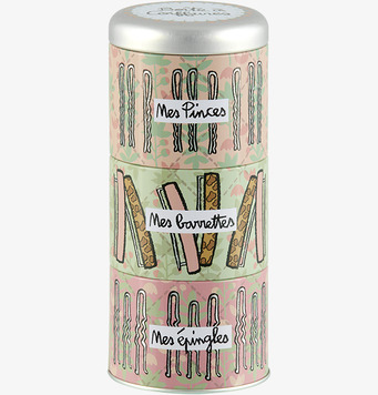 Bild av plåtburk med lekfull design för hårspännen