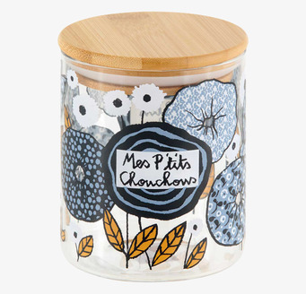 Bild av dekorativ glasburk med bambulock och blommönster