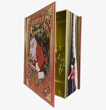 Bild av plåtburk formad som bok med jultema