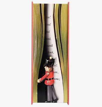 Bild av charmig plåtburk med bokdesign och tomte