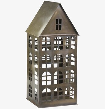 Foto av ljuslykta i antik mässing med husdesign