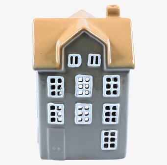 Bild av ljuslykta i form av ett hus med charmig design