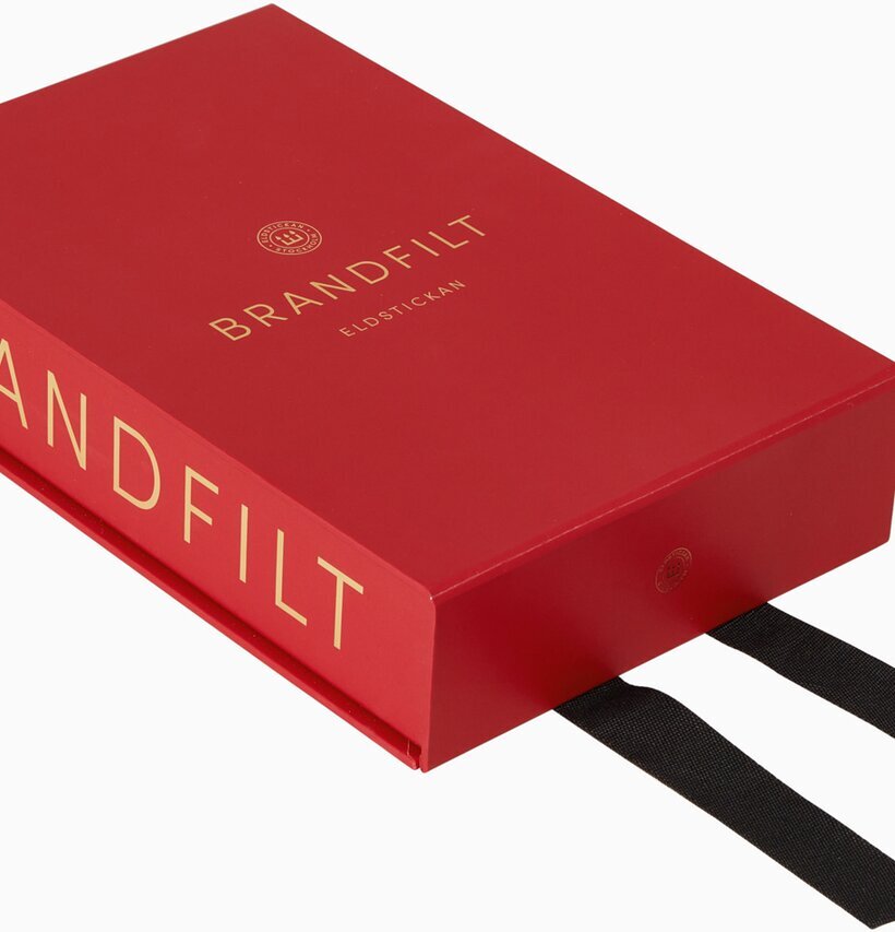 Brandfilt Eldstickan Röd i röd låda med gula bokstäver