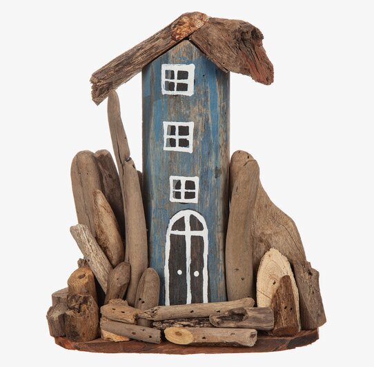 Hus Drivved från Different Design med blå fasad och drivved