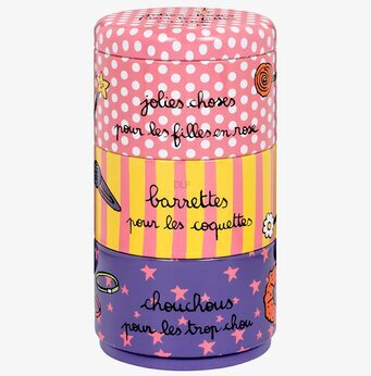 Bild av färgglad plåtburk för håraccessoarer i tre sektioner