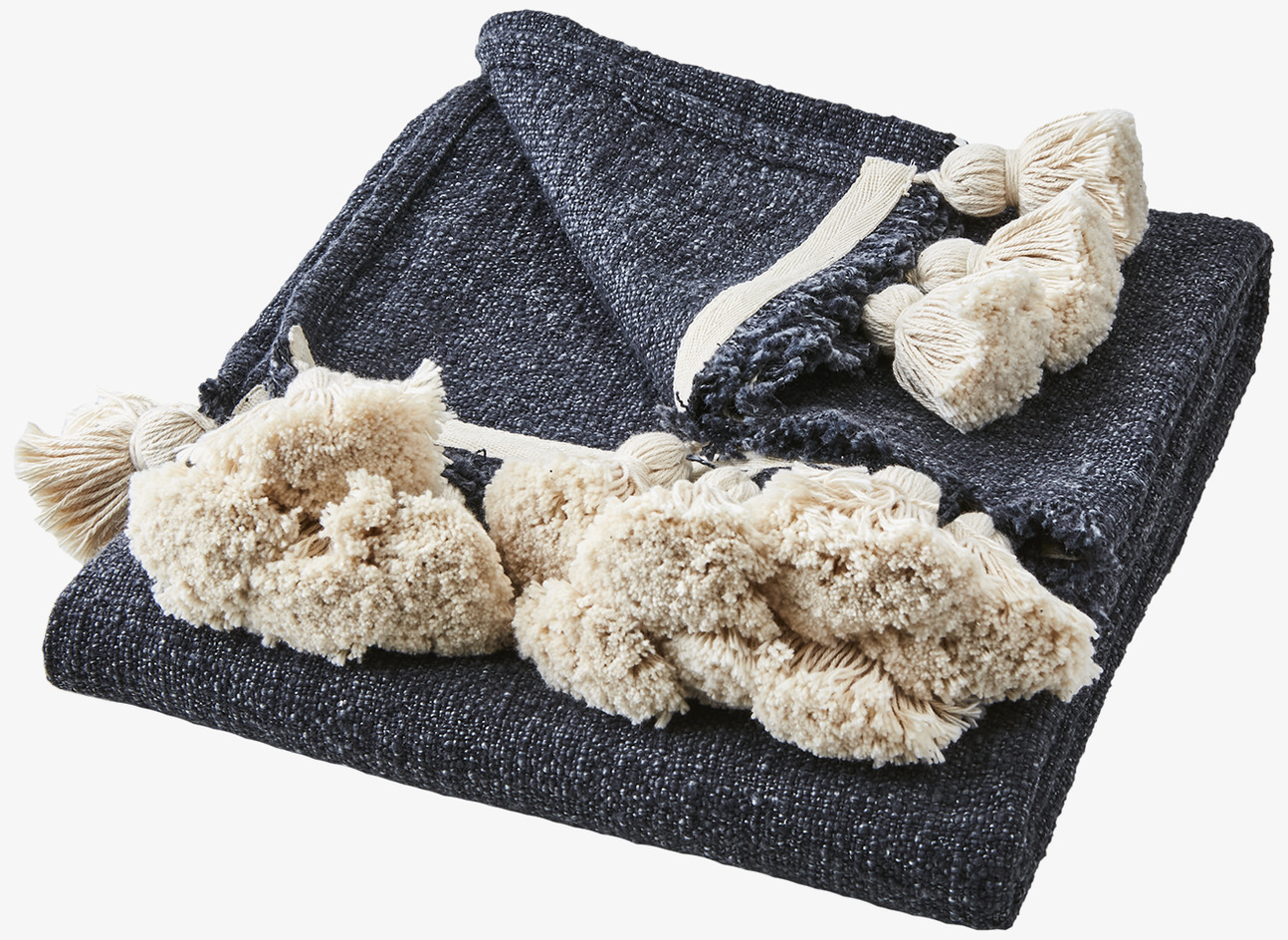 Pläd Lolly Midnattsblå/Natur från Affari med tofsdetaljer