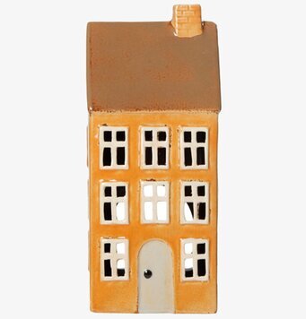 Foto av ljuslykta i form av ett gult keramikhus