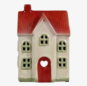 Foto av dekorativ ljuslykta utformad som ett hus