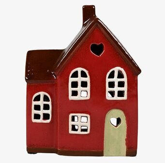 Bild av röd ljuslykta i form av ett charmigt hus