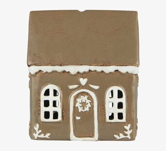 Foto av stämningsfull ljuslykta som pepparkakshus