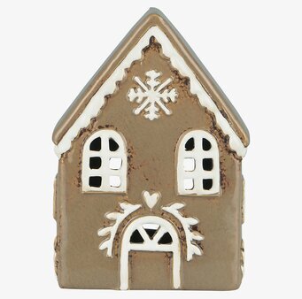 Foto av charmig ljuslykta formad som pepparkakshus