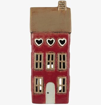 Foto av dekorativ ljuslykta formad som ett litet hus