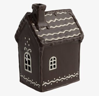 Foto av dekorativ ljuslykta i form av pepparkakshus