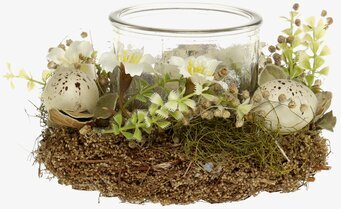 Bild av dekorativ ljuslykta med påsktema och natur