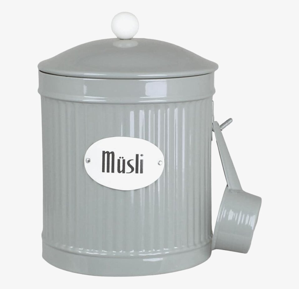 Bild av grön plåtburk för müsliförvaring i köket