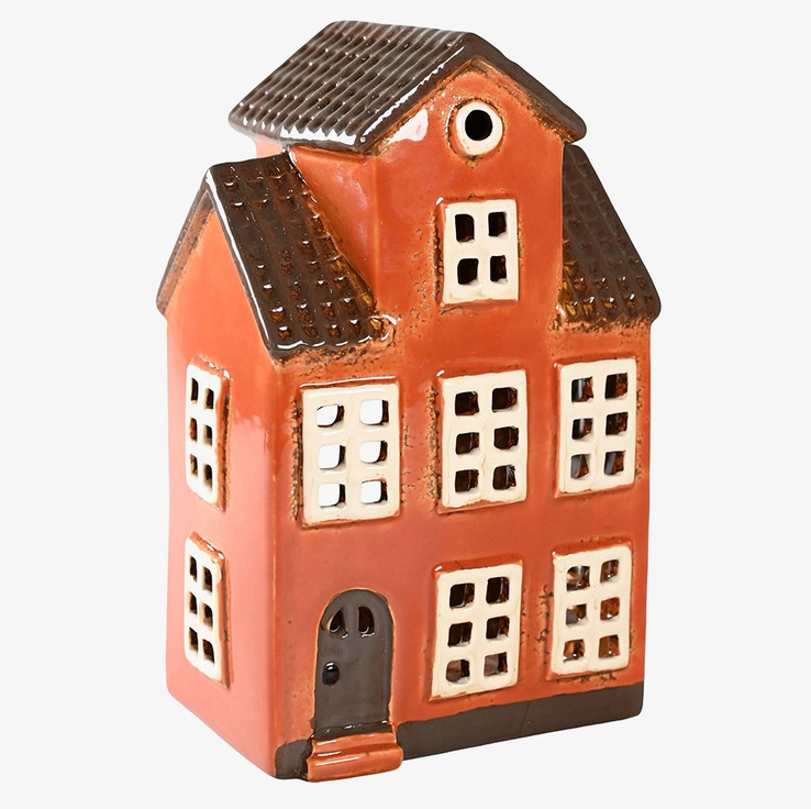 Bild av ljuslykta i form av ett traditionellt hus