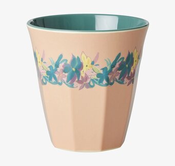 Bild av färgstark mugg med blommönster och grön insida