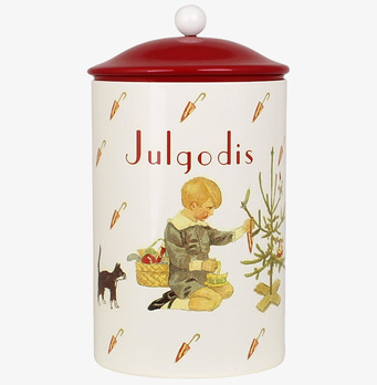 Foto av charmig plåtburk med julmotiv och rött lock