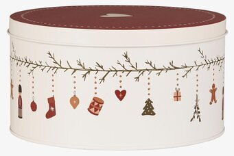 Bild av rund plåtburk med julmotiv och dekorationer