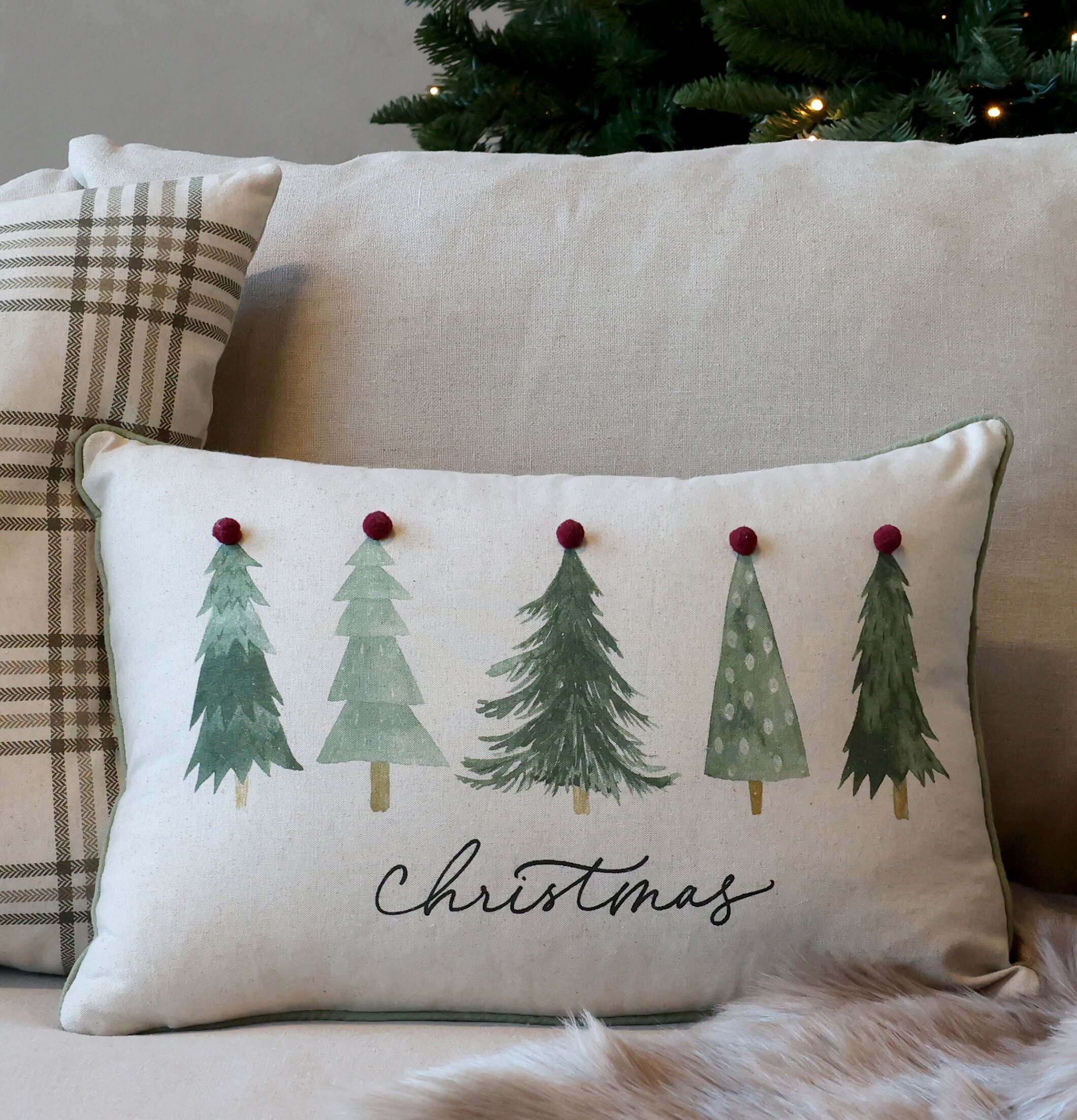 Kuddfodral Christmas från Chic Antique på beige soffa