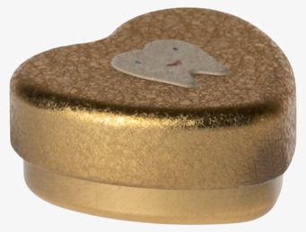 Foto av gyllene hjärtformad burk med tandillustration