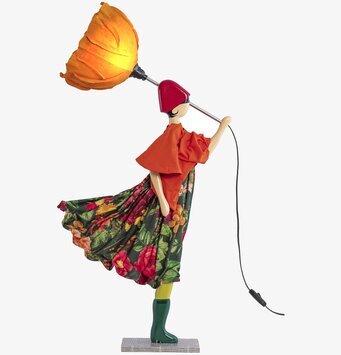 Bild av en unik och färgglad bordslampa i rörelse