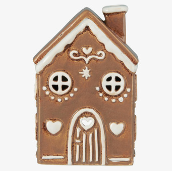 Foto av ljuslykta formad som ett pepparkakshus