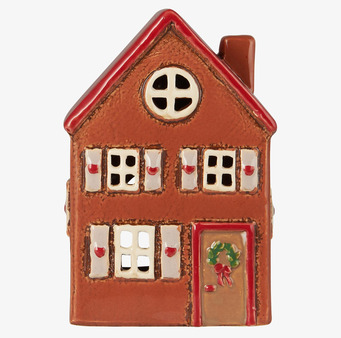 Foto av charmig keramisk ljuslykta formad som ett hus