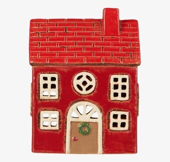 Bild av charmig ljuslykta i form av ett rött hus