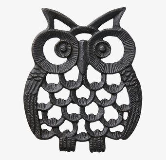 Bild av stiliserat uggla grytunderlägg i robust metall