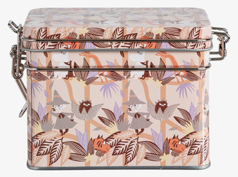 Bild av detaljerad, orange teburk med Mumin-design