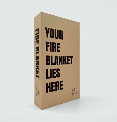 Bild av stilren brandfilt i sandfärgad förpackning