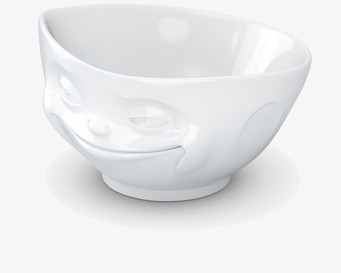 Bild av porslinsskål med flinande ansikte och charm