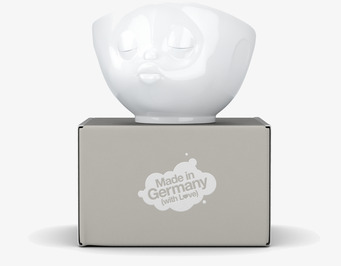 Bild av porslinsskål med ansikte och elegant design