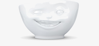 Bild av porslinsskål med lekfullt ansikte och glansig yta