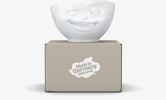 Bild av dekorativ porslinsskål med leende ansikte