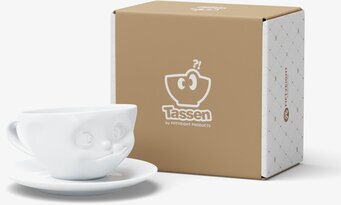 Foto av lekfull kaffekopp med ansikte och matchande fat