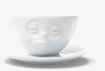 Bild av unik kaffekopp med ansiktsdesign och fat