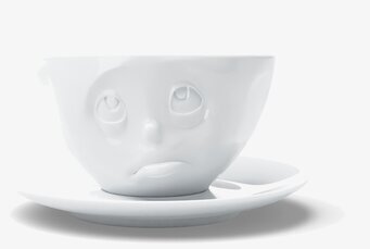 Bild av unik kaffekopp med ansikte och matchande fat