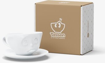 Bild av unik kaffekopp med ansikte och fat i porslin